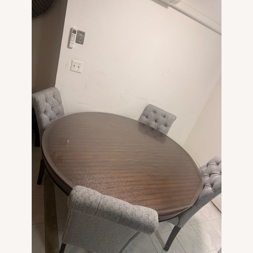 Used Raymour & Flanigan Dark Brown Wood Dining Set for sale on AptDeco