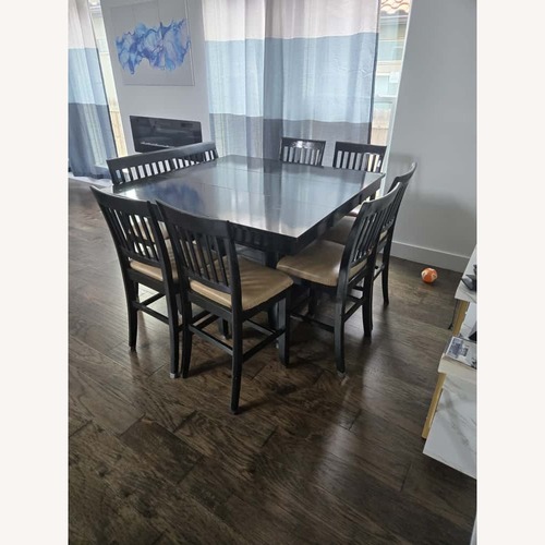 Used Black Wood Dining Table for sale on AptDeco