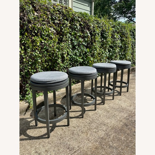 Used RH Balmain Aluminum Swivel Outdoor Stools Set of 4 for sale on AptDeco