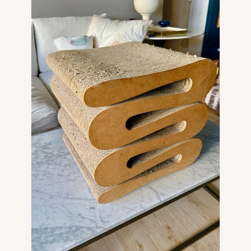 Used Frank Gehry Wiggle Natural Ottoman for sale on AptDeco