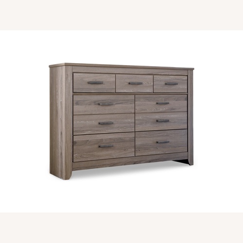 Used Ashley Furniture Zelen 7 Drawer Dresser for sale on AptDeco