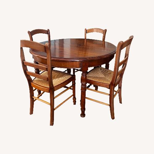 Used Round Extendable Dining Room Set for sale on AptDeco