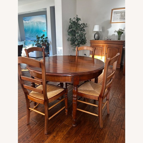 Used Round Extendable Dining Room Set for sale on AptDeco