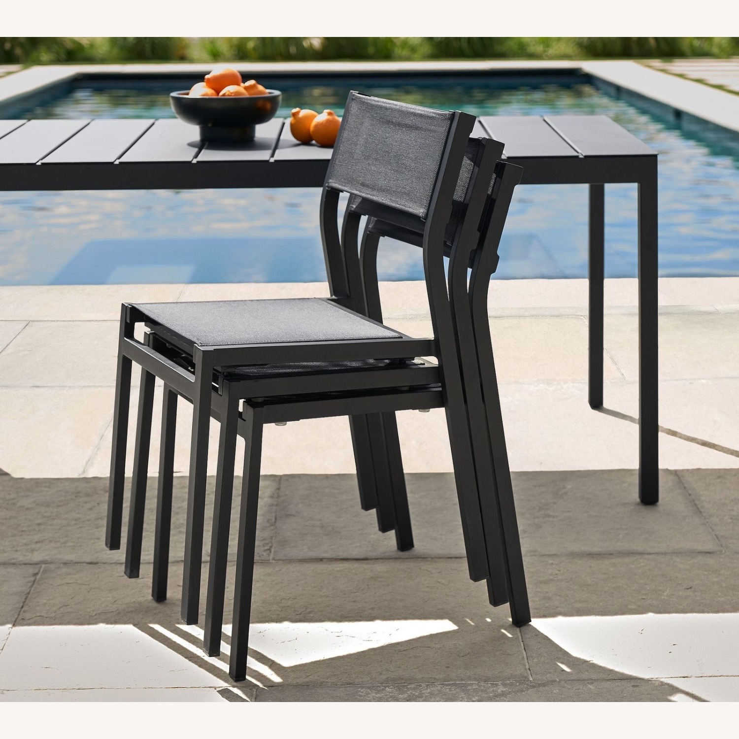 Pottery Barn Black Metal Stackable Dining Chairs - image-1