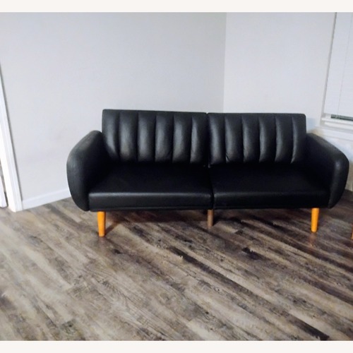 Used  Ashley Furniture Black Faux Leather Futon for sale on AptDeco