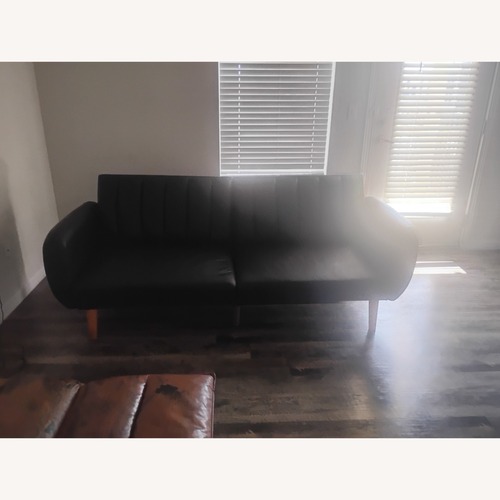 Used  Ashley Furniture Black Faux Leather Futon for sale on AptDeco