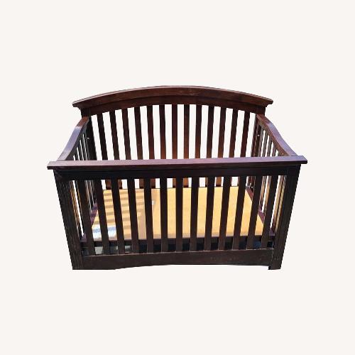 Used Quality Bliss Curved Top Wood Crib for sale on AptDeco