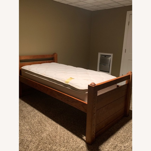 Used Solid Brown Wood Twin Bed for sale on AptDeco