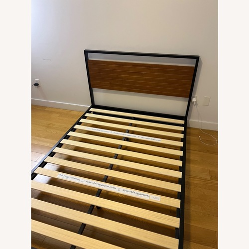Used Black Wood Queen Bed for sale on AptDeco
