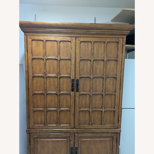 Used Light Brown Wood Armoire for sale on AptDeco