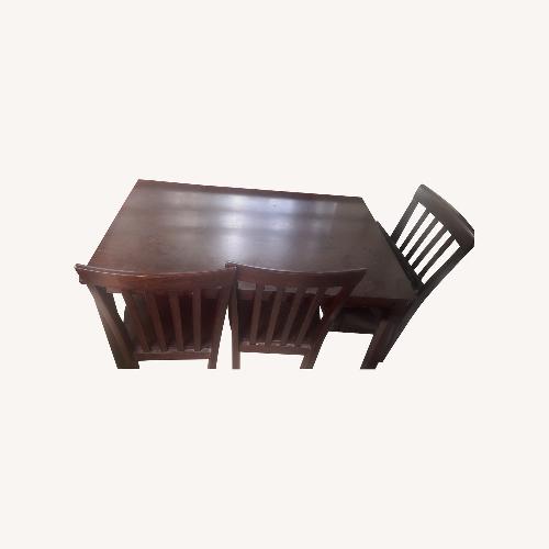 Used Wood Dining Room Table With 4 Chairs for sale on AptDeco