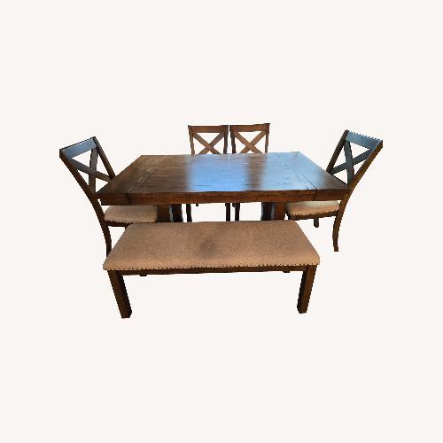 Used Ashley Furniture Moriville Dining Table and 4 Chairs and Bench for sale on AptDeco