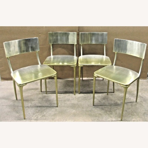 Used CB2 Oro Silver Aluminum Dining Chairs for sale on AptDeco