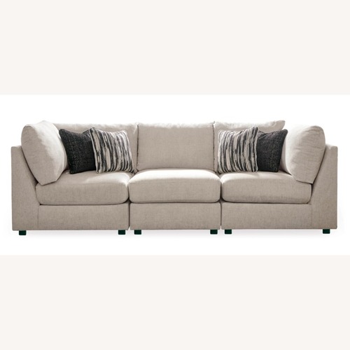 Used Ashley Furniture Kellway Beige Modular Couch & Ottoman for sale on AptDeco