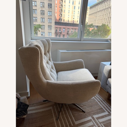 Used Pottery Barn Wells Tufted Swivel Chair Armchair for sale on AptDeco