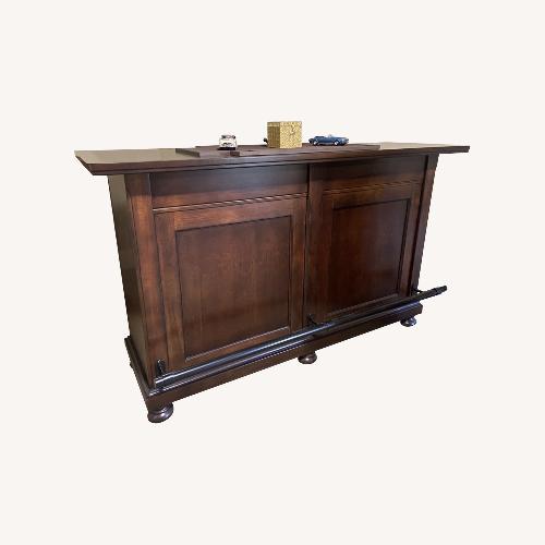 Used Ashley Furniture Dark Brown Wood Bar Cart for sale on AptDeco