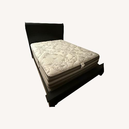 Used Jordan's Furniture Black Wood Queen Bed for sale on AptDeco