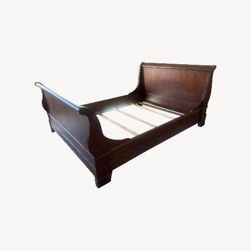 Used Solid Wood Cherry Queen Sleigh Bed for sale on AptDeco