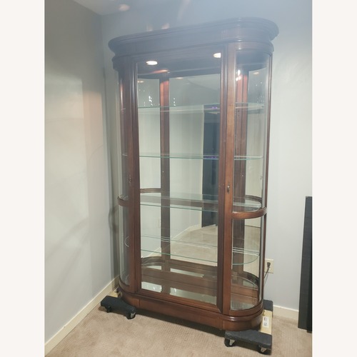 Used Pulaski Furniture Dark Brown Wood Armoire for sale on AptDeco