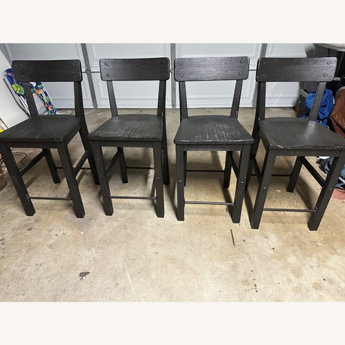 Used Pottery Barn Benchwright Black Wood Stools for sale on AptDeco