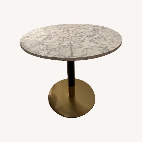 Used White Wood Faux Marble Top Dining Table for sale on AptDeco
