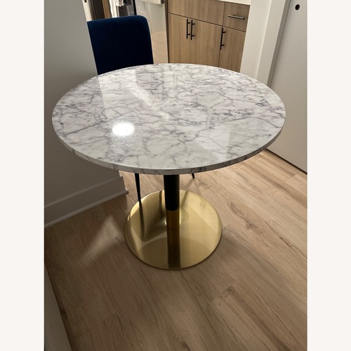 Used White Wood Faux Marble Top Dining Table for sale on AptDeco