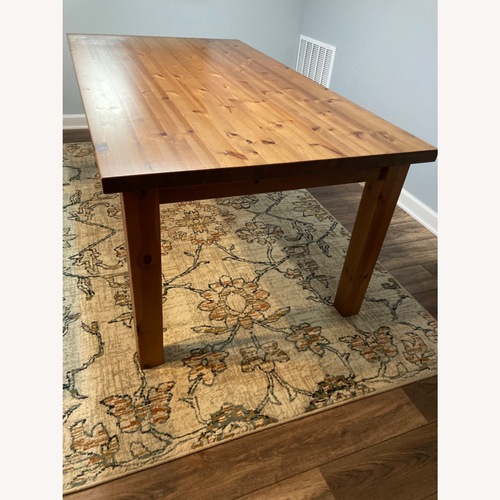 Used IKEA Natural Wood Dining Table for sale on AptDeco