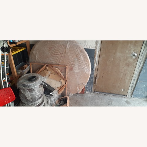 Used Dark Brown Wood Dining Table for sale on AptDeco