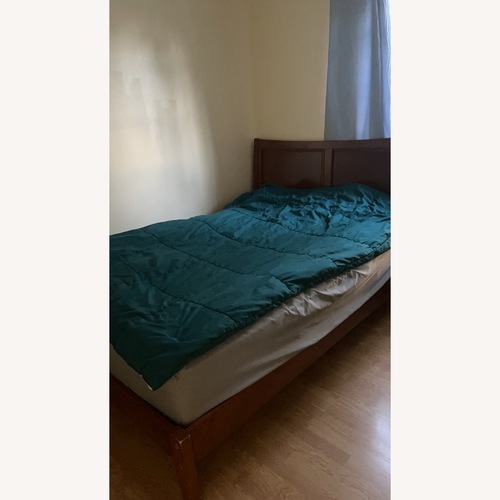 Used Wood Queen Bed for sale on AptDeco