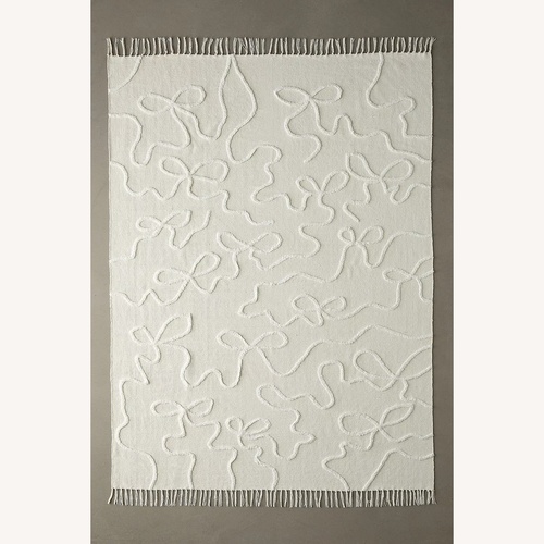 Used Wild Bows Rug for sale on AptDeco