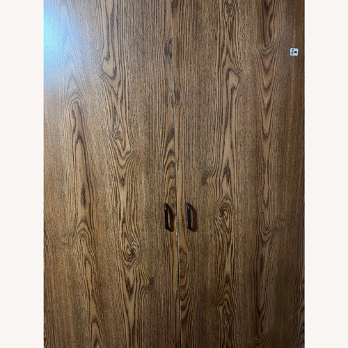 Used Armoire Wardrobe With Shelves and Hanging Bar for sale on AptDeco