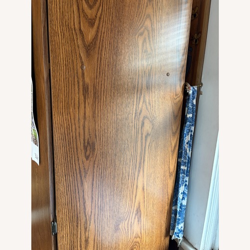 Used Armoire Wardrobe With Shelves and Hanging Bar for sale on AptDeco