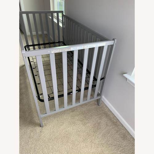 Used Light Gray Wood Crib for sale on AptDeco