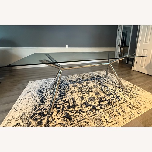 Used West Elm Glass Chrome Trestle Dining Table for sale on AptDeco