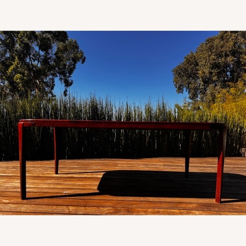 Used Dark Brown Wood Dining Table for sale on AptDeco