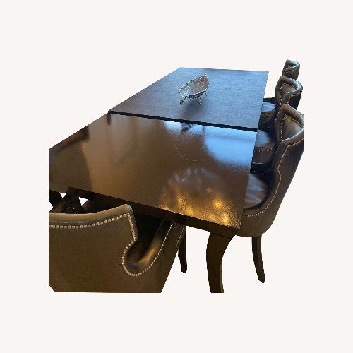 Used Dark Brown Wood Dining Table for sale on AptDeco