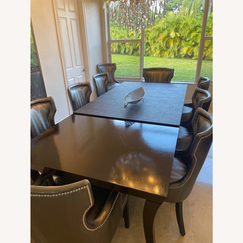 Used Dark Brown Wood Dining Table for sale on AptDeco