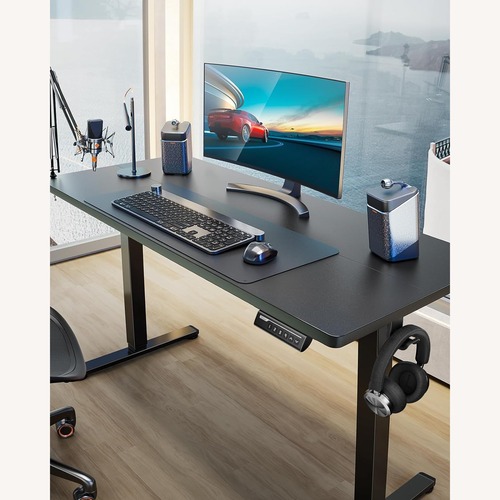 Used Black Metal Height Adjustable Electric Desk for sale on AptDeco