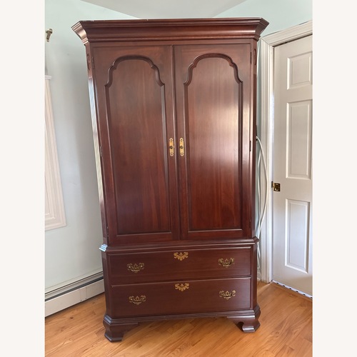 Used Ethan Allen Dark Brown Wood Armoire for sale on AptDeco