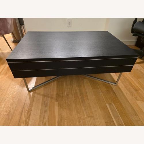 Used Black Wood Coffee Table for sale on AptDeco