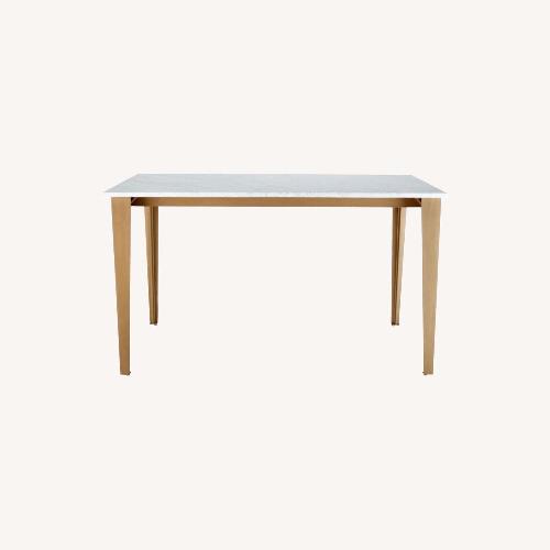 Used CB2 Paradigm 54" Carrara Marble Brass Dining Table for sale on AptDeco