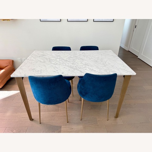 Used CB2 Paradigm 54" Carrara Marble Brass Dining Table for sale on AptDeco