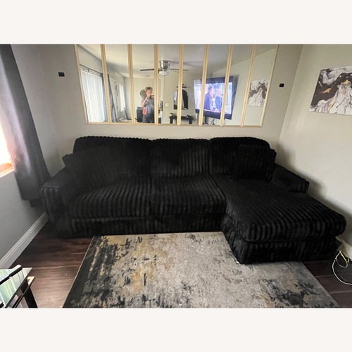 Used Ashley Furniture Midnight-Madness 2-Piece Sofa with Chaise for sale on AptDeco