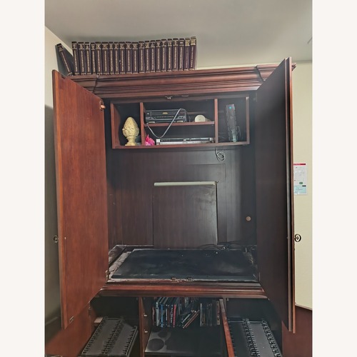 Used Ashley Furniture Wood Armoire for sale on AptDeco