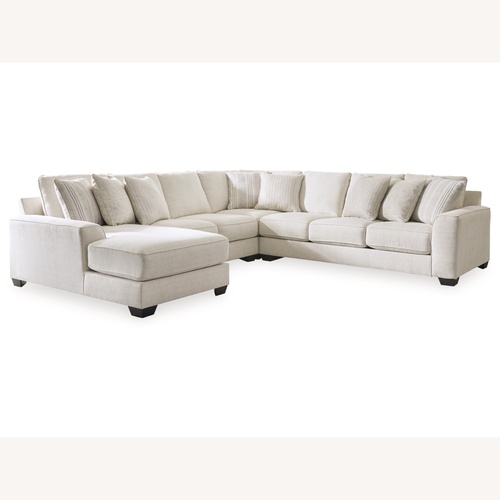 Used Ashley Furniture Lerenza 4-Piece Sectional with Chaise for sale on AptDeco