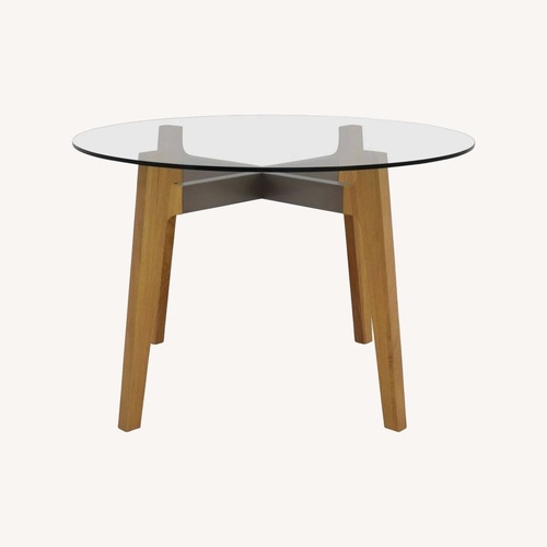 Used Crate & Barrel Brace Round Glass Table for sale on AptDeco