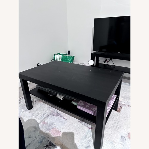 Used IKEA Black Wood Coffee Table for sale on AptDeco