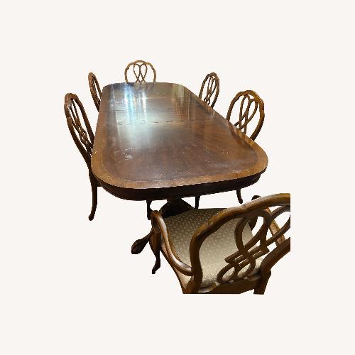 Used Dark Brown Wood Dining Set for sale on AptDeco
