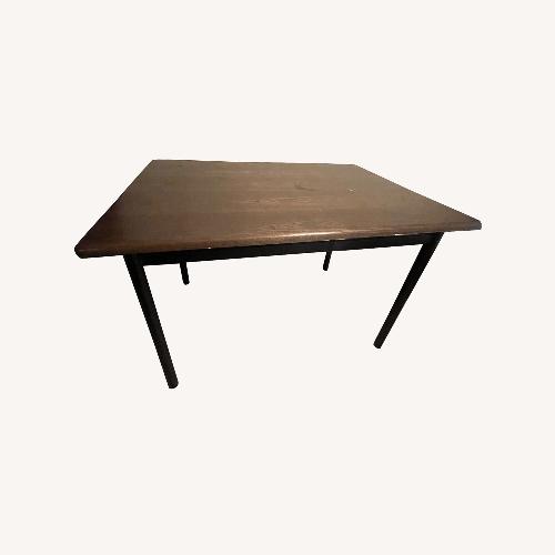 Used Brown Wood Dining Table for sale on AptDeco