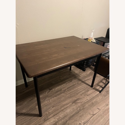Used Brown Wood Dining Table for sale on AptDeco